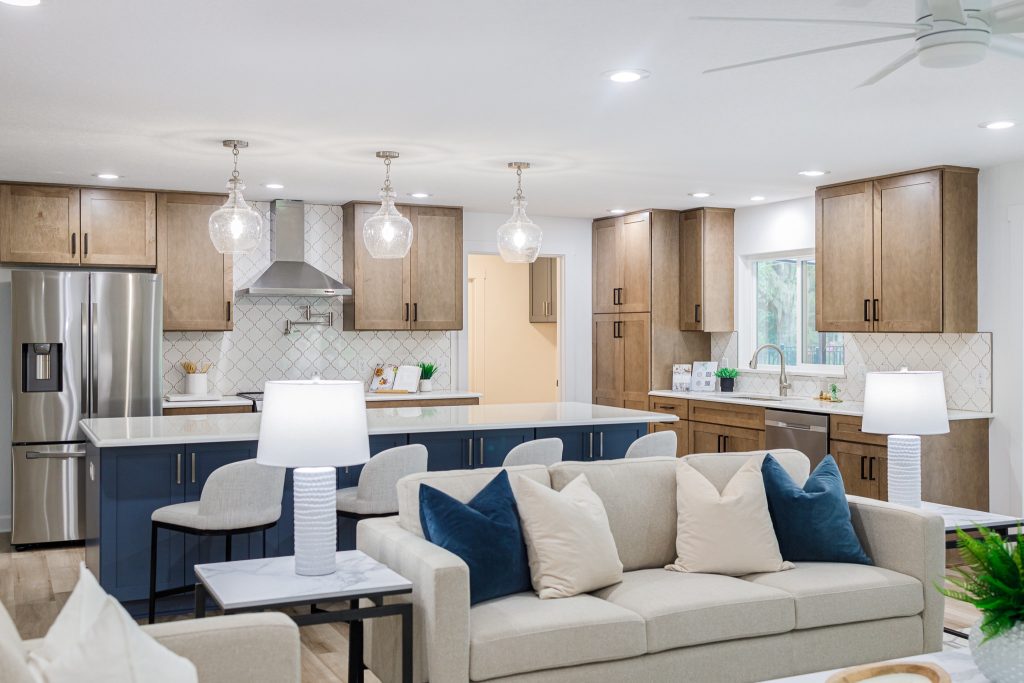 Luxury staged kitchen with living room with smart lighting in Central Florida