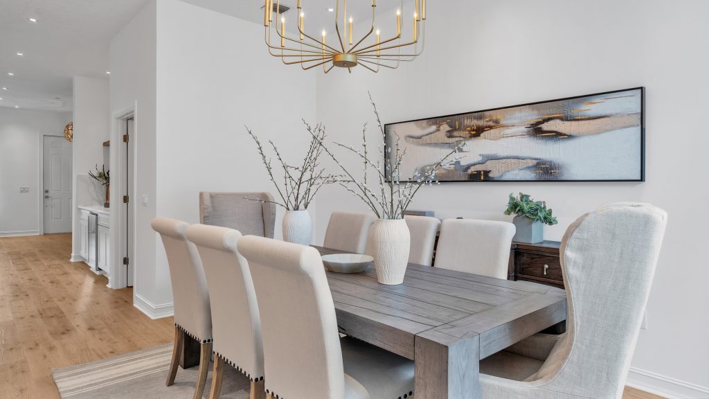 Oversized chandeliers in a luxury staged dining room in Central Florida