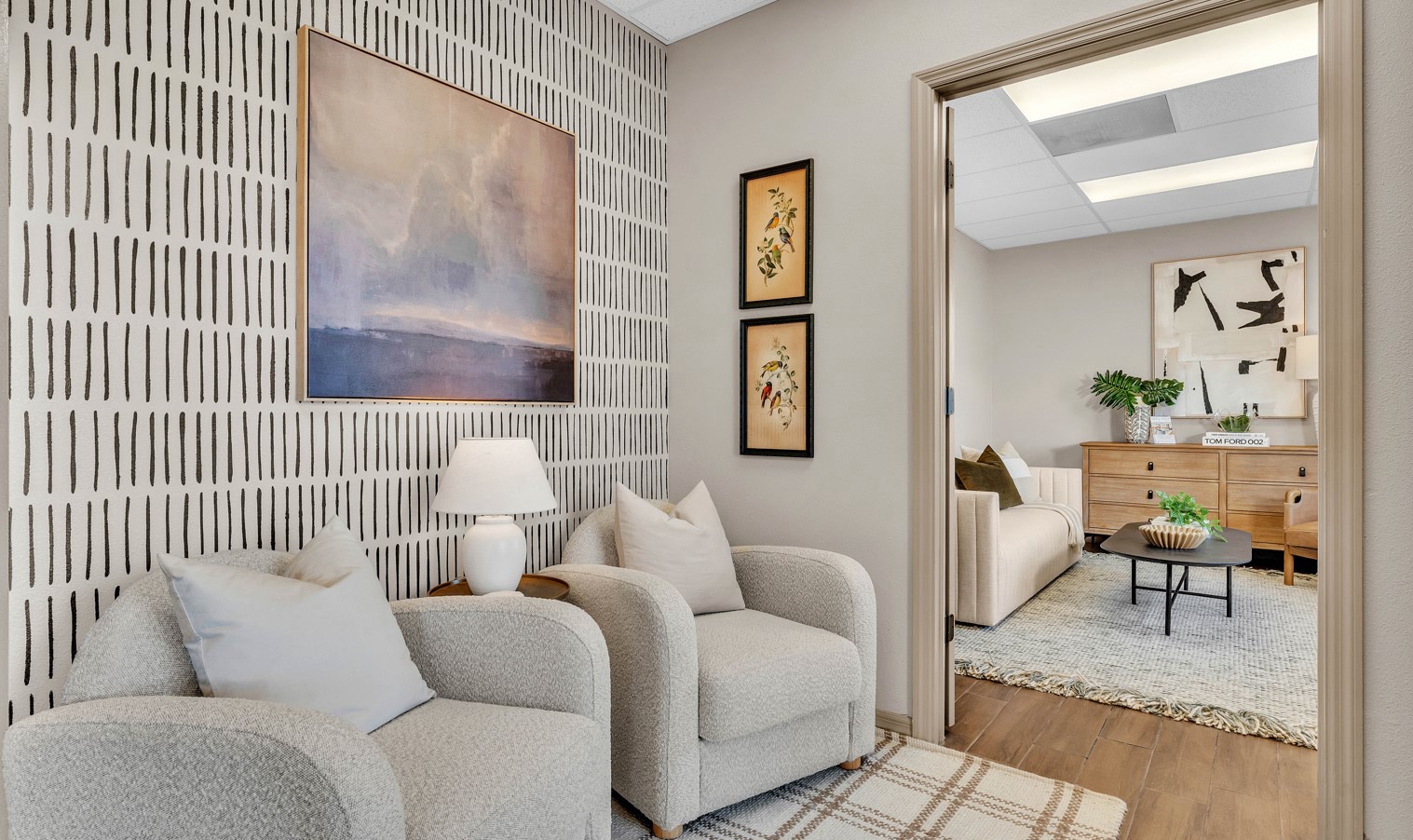 Luxury-staged living room in central florida with modern artwork and beige furniture